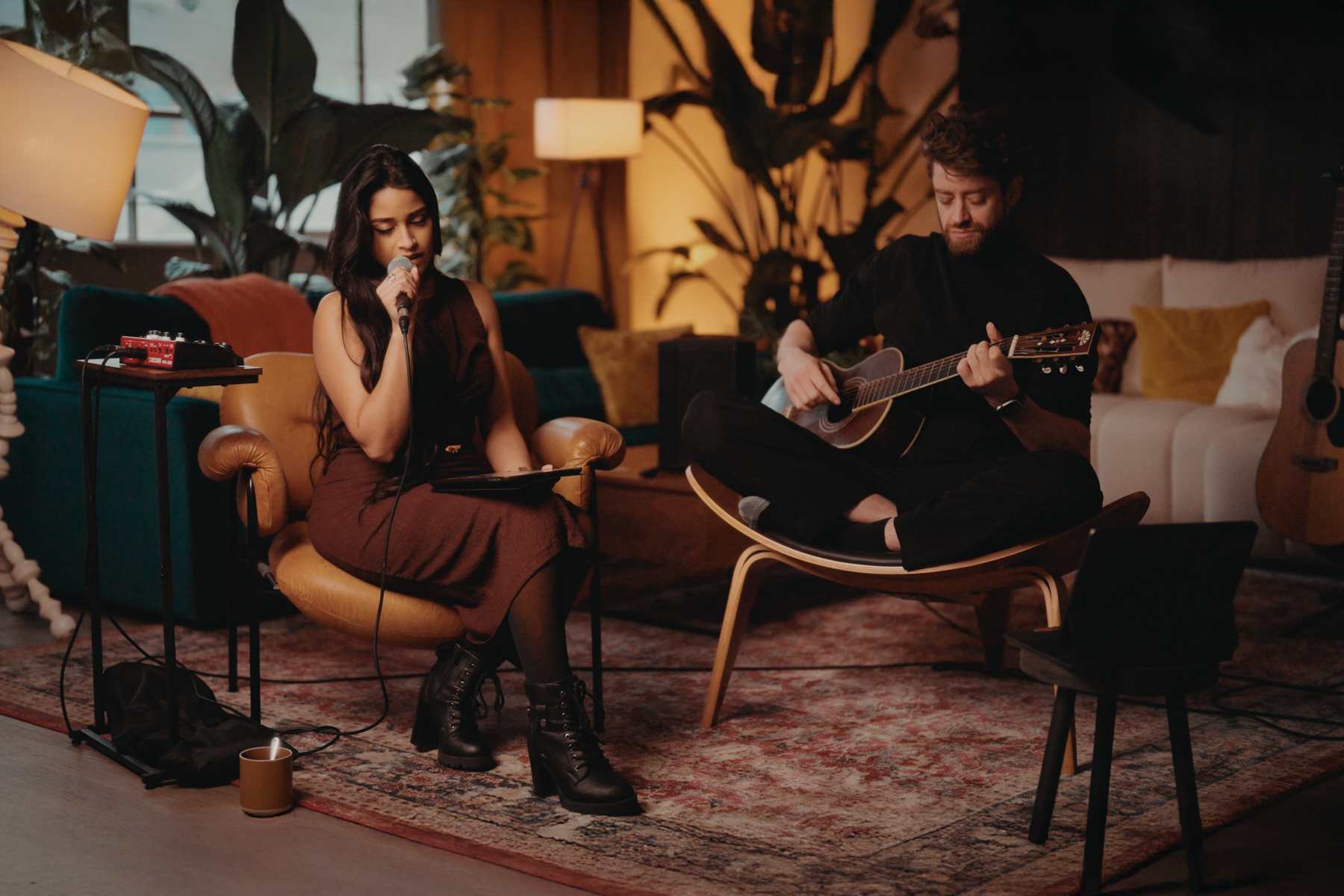 Two performers recording a song during a styled music shoot in the Old Street penthouse studio