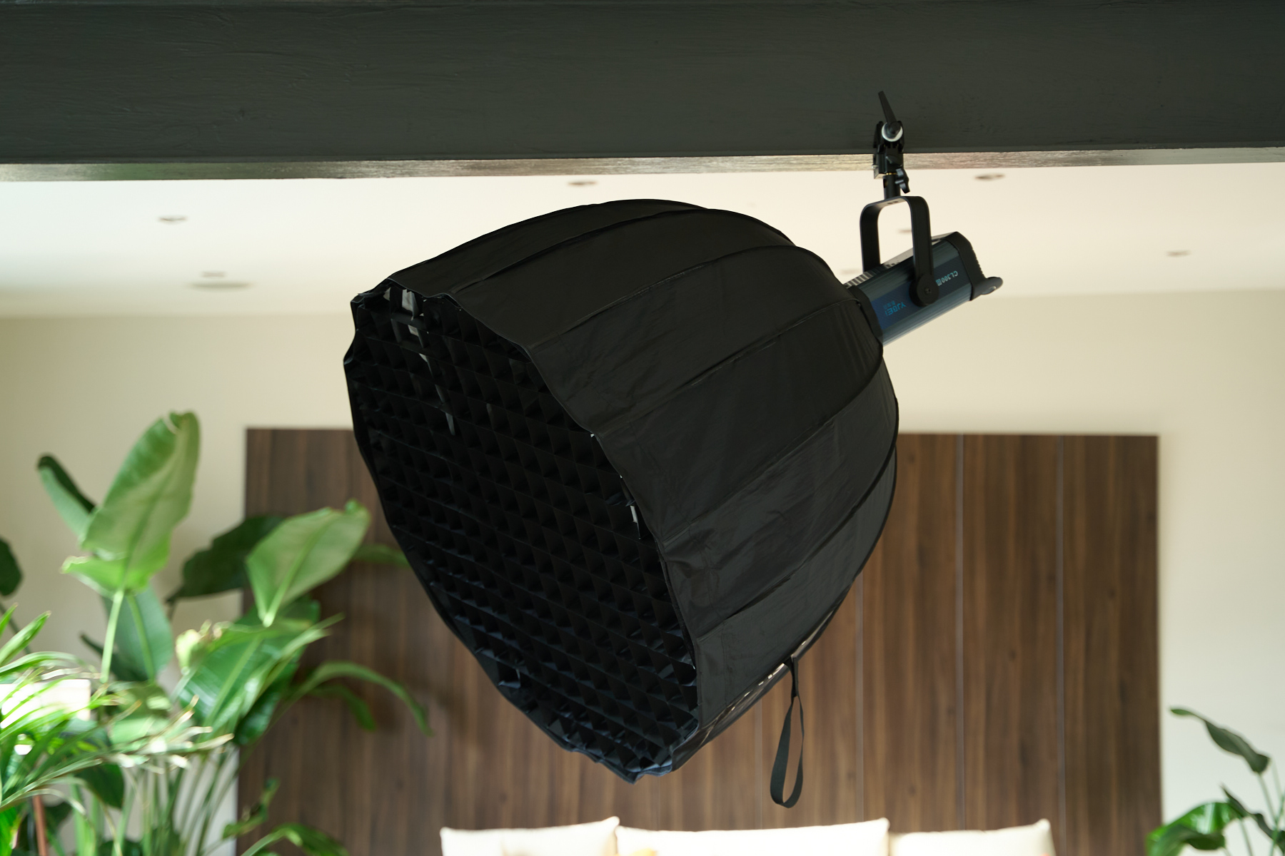 Lights and camera fixed to the exposed I-beam ceiling for overhead production rigging at the penthouse