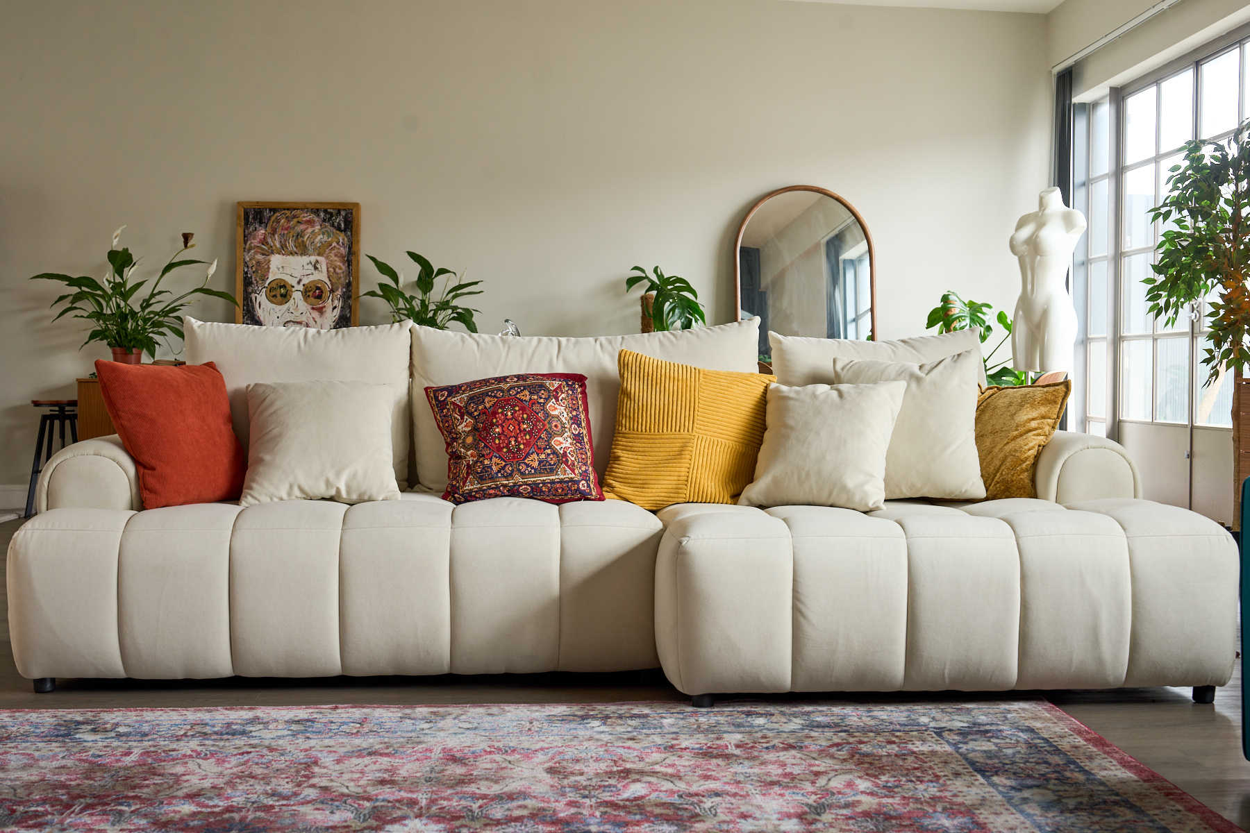 Warm-toned lounge area with designer sofa and furniture in the Old Street penthouse