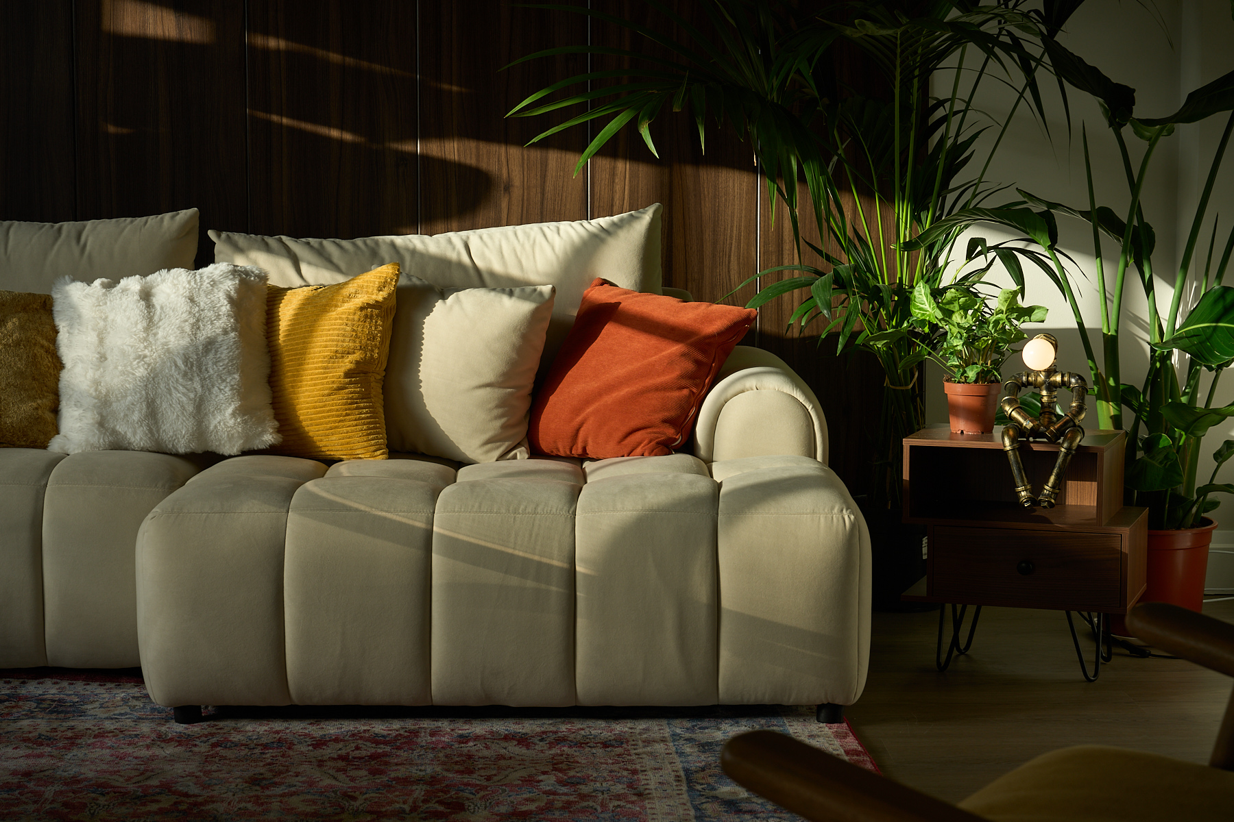 Atmospheric sofa and lounge area with warm tones in the Old Street penthouse