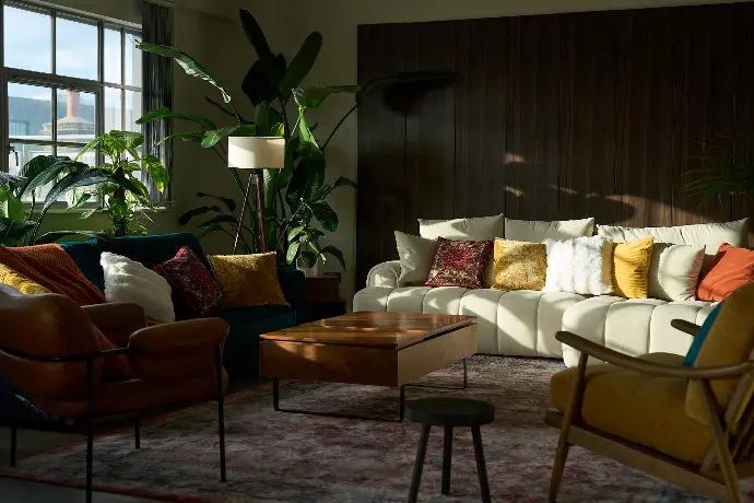 Stylish living area in a Shoreditch penthouse with warm lighting and modern furniture, ideal for meetings and creative shoots.