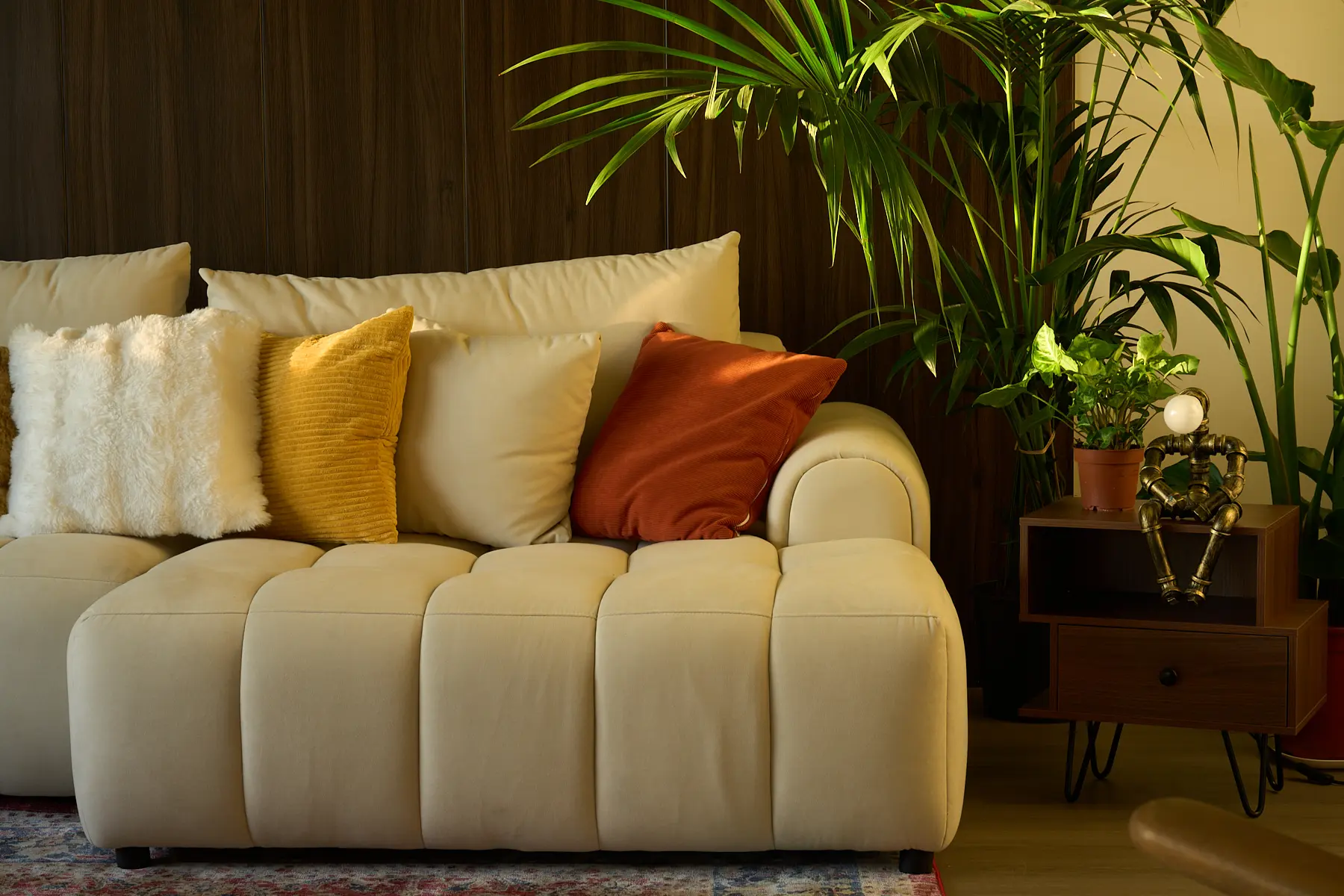 Elegant sofa seating with warm tones in a Shoreditch penthouse, creating a welcoming event atmosphere.