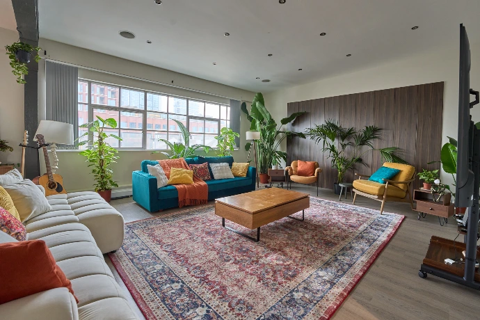 Spacious open-plan living room in a London penthouse, adaptable for events, filming, and photoshoots.