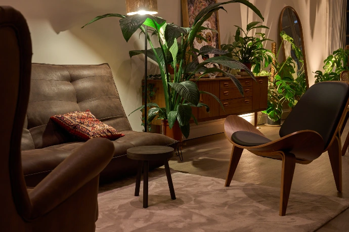 Stylish seating area with plants in a Shoreditch penthouse, ideal for informal discussions and creative work